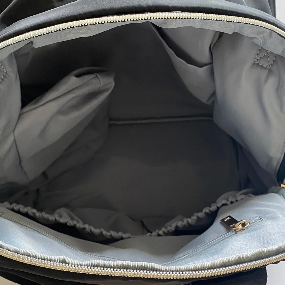Skip Hop Black Quilted Multifunctional Backpack with Tan and gold accents